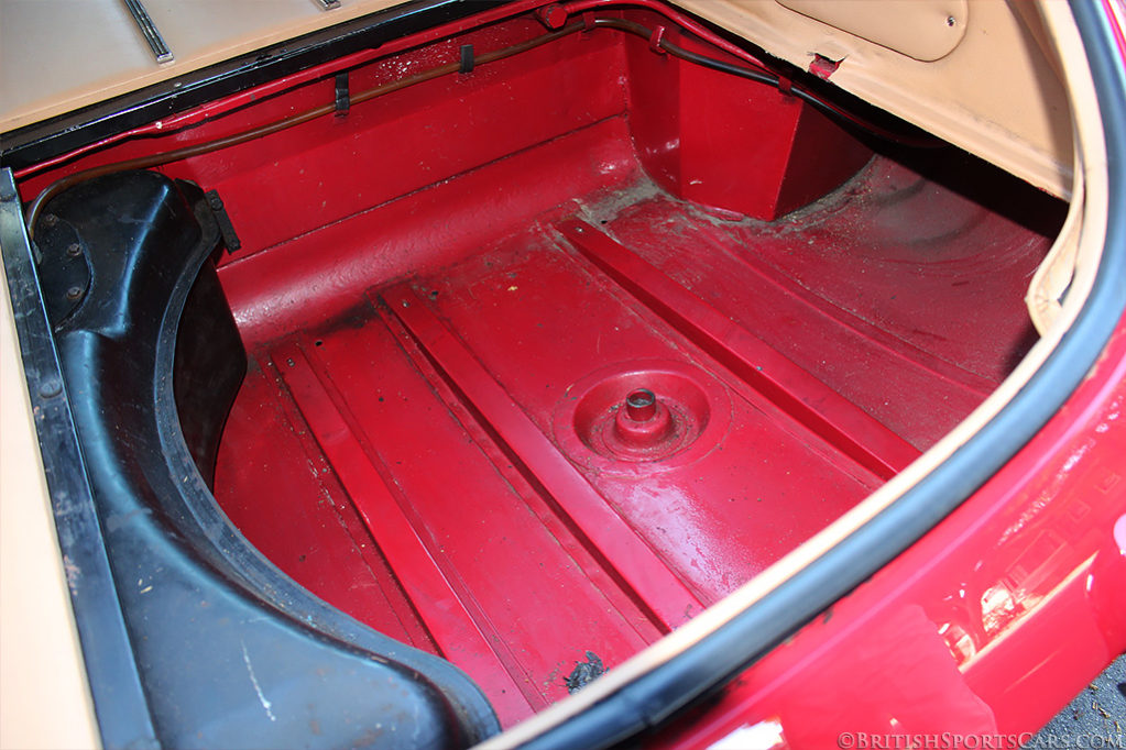 Look for surface rust in the boot floor that results from leaks in the boot lid.