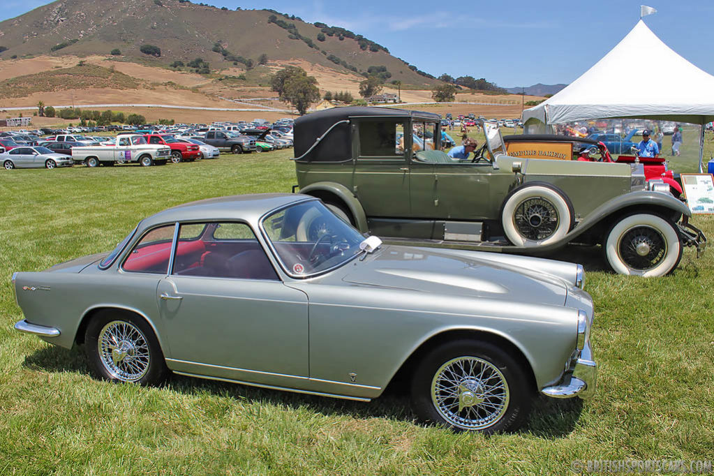 1960 Triumph Italia with a 1927 Rolls-Royce in the background.